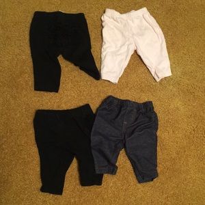 Size 3 month bottoms. 2 black with ruffles, one Jean look, and one pink.
